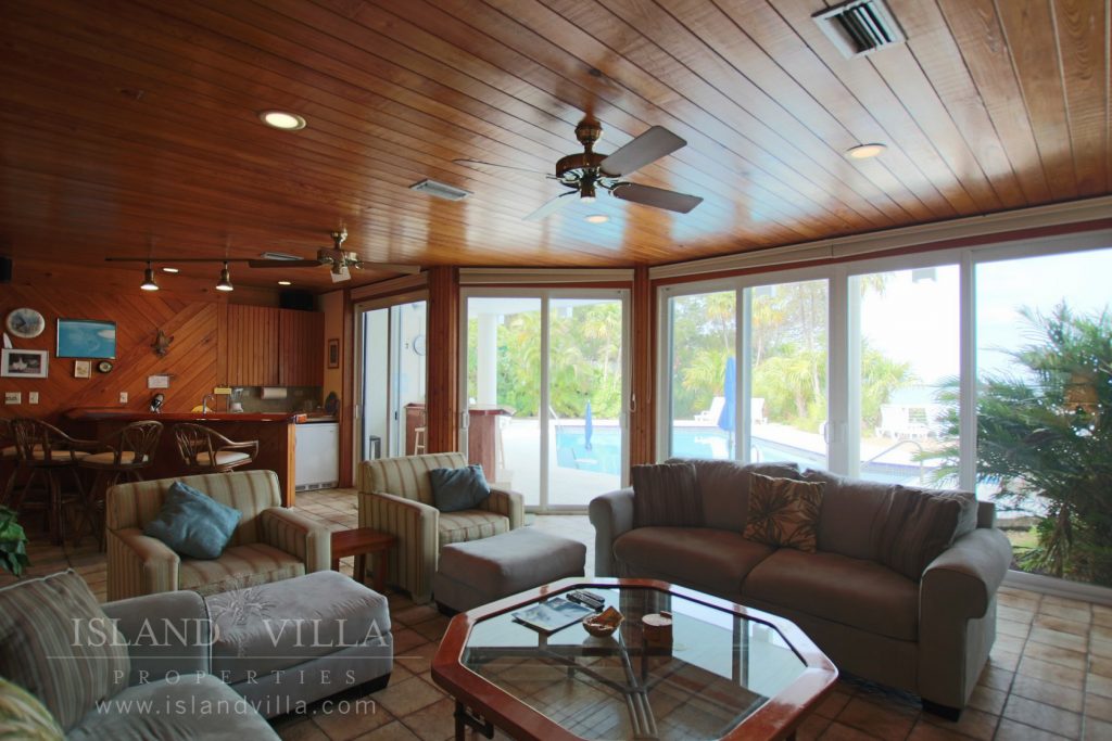 wall to wall windows in the living room at osprey bay vacation rental
