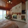 master bedroom suite with wall to wall sliding glass doors